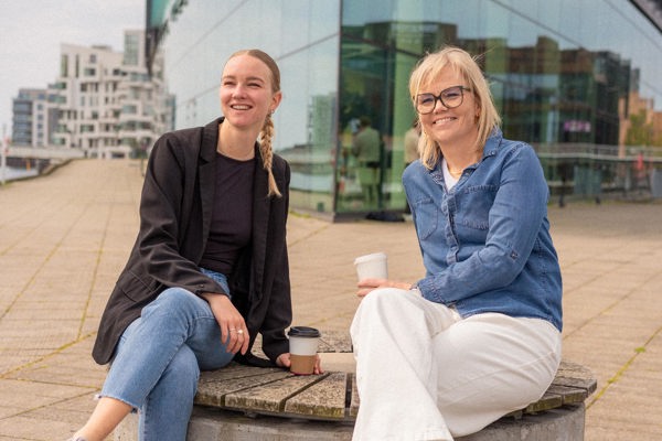 Katrine and Jannie from Context& enjoying a coffee in the sun