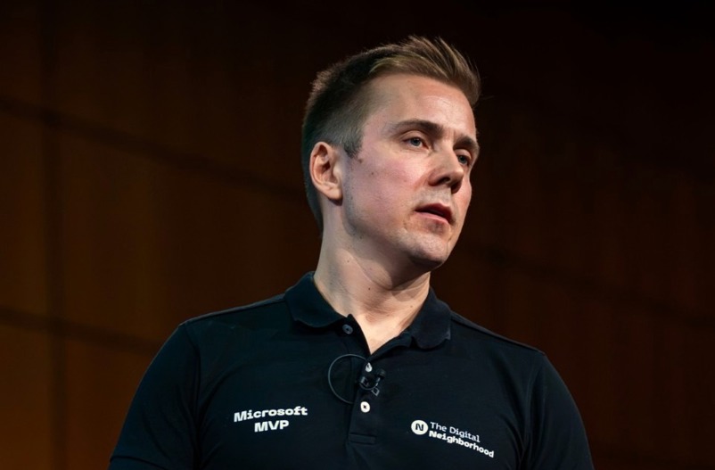 White male in black tshirt on black background