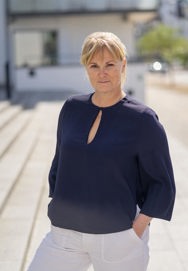 Jeanne Grundtvig Theander Laisbo looking at the camera with her hands in her pocket