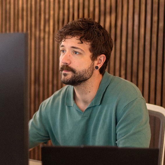 Gudfinnur from Context& working in front of a computer