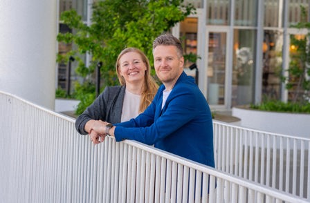 Jimmi Henvig and Lilian Stenholt standing outside by the railing