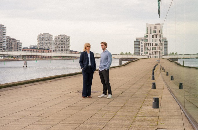 Man and woman talking on the harbor in Copenhagen